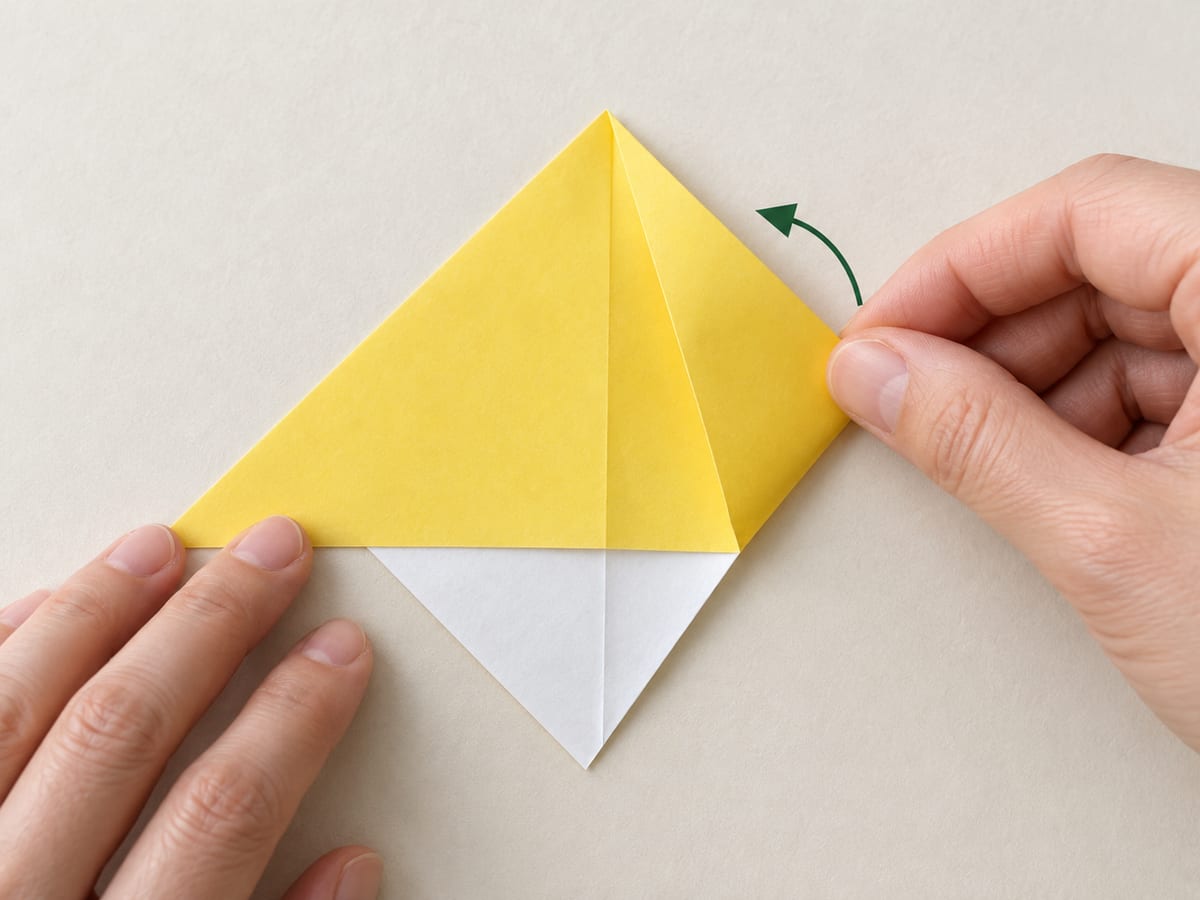 origami bookmark step 3: fold the right corner up to the top point, crease, then return it to the right, hands visible