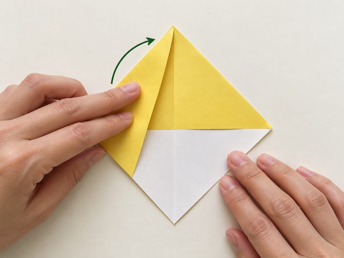 origami bookmark step 4: fold the left corner up to the top point, crease, then return it to the left, hands visible
